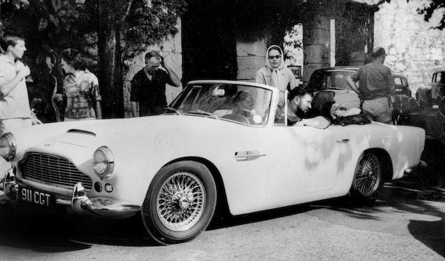 eter Ustinov at the wheel of the 1962 Aston Martin DB4 Vantage convertible | Bonhams photos