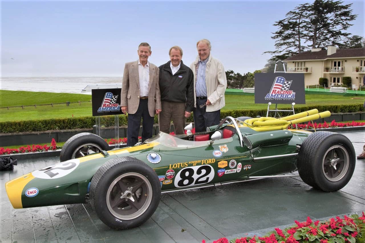 The Lotus-Ford 38 that first won Indy, shown at Pebble Beach in 2010 with champion drivers Bobby Unser (left) and Dan Gurney (right), along with Edsel B. Ford II | Pebble Beach Concours photos