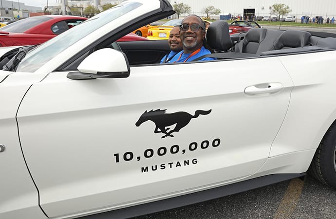 Some attendees sit in the 10 millionth Ford Mustang to roll off the production line. | Ford Motor Company photo