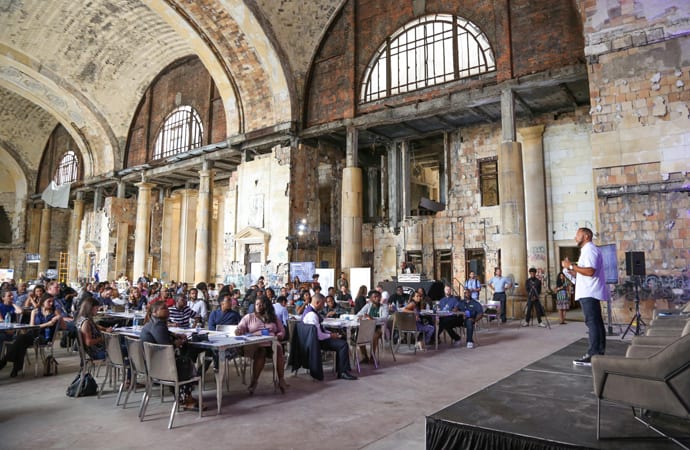 A Ford official addresses a crowd of millennial leaders. The company sought input from the community about how it should revamp a historic train station that will be a centerpiece of a new Detroit campus. | Ford Motor Company photo
