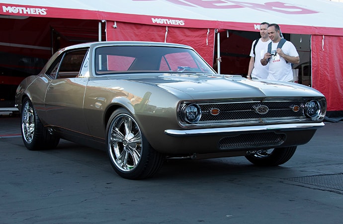 SEMA Show attendees check out a 1967 Chevrolet Camaro SS nicknamed Nickelback that won the Mothers Shine Award. | Mothers photo