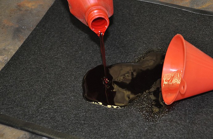 Rug keeps garage oil spills to a minimum