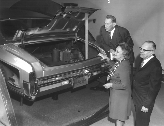Frederick Crawford and Ruth Swihart look over one of the cars in the collection